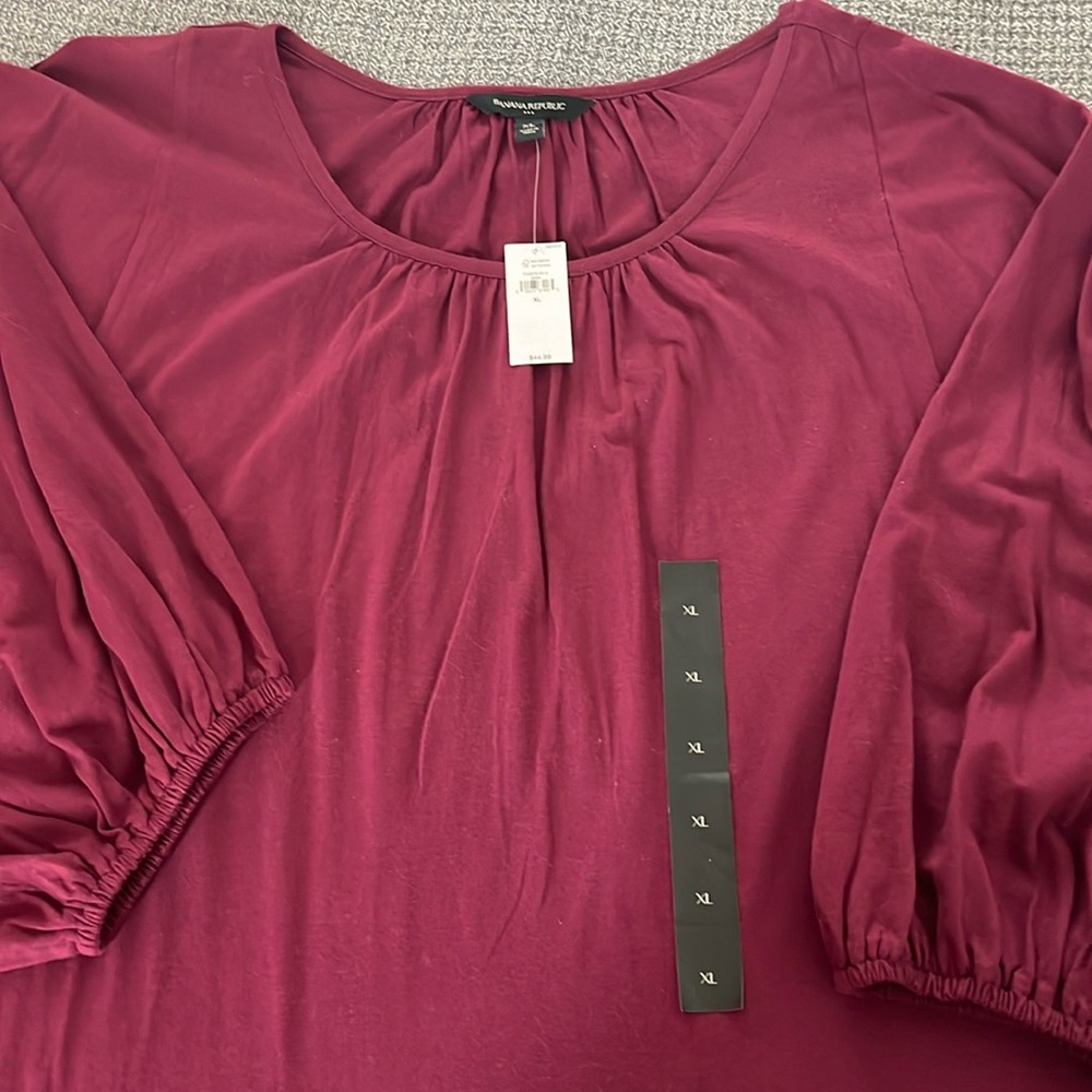 Women's 3/4 sleeve top size XL. Never worn.